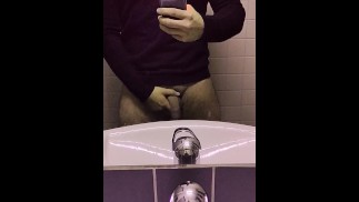 Hot man whips out his big soft cock in a public restroom