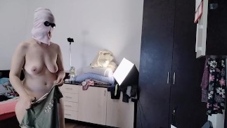 Amateur wife has fun trying on clothes and cutting them. Amateur wife dances naked around the house.
