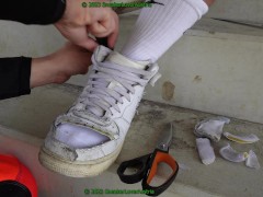 cutting black and white nike af1 mid from slaves feet