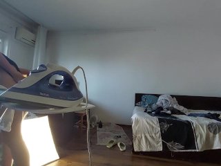 Amateur mom does chores in the naked house.