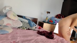 Sexy wife has fun trying on clothes and cutting them. Brunette dances naked around the house.