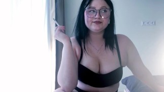Sexy Curvy Brunette Smoking Cigarette