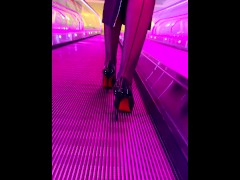 A girl wearing black nylons stockings and high heels