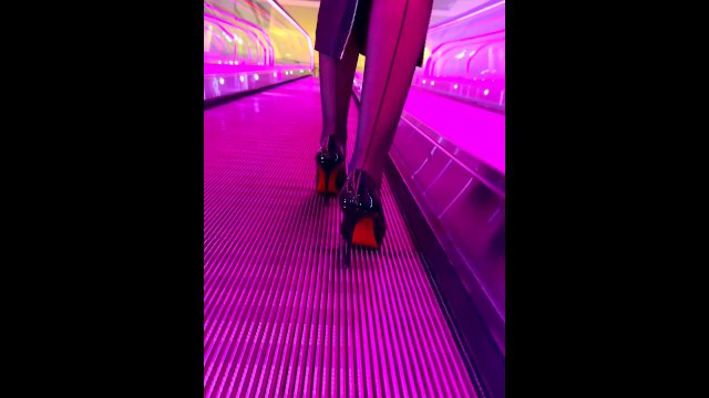 A girl wearing black nylons stockings and high heels