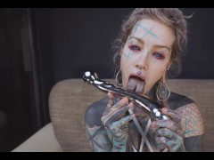 Anuskatzz presses the smooth steel against her hole, moaning as she pushes it all the way in