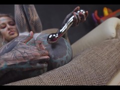 Anuskatzz bends over, teasing her hole with the cold steel before shoving it deep inside