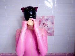 Rubber doll in nylon takes a shower