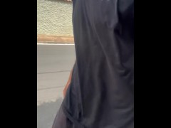Alpha male with huge dick walking down the street in pants without underwear with the volume showing