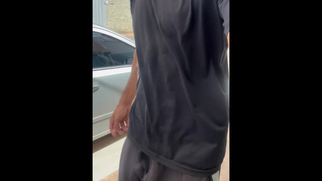 Alpha male with huge dick walking down the street in pants without underwear with the volume showing